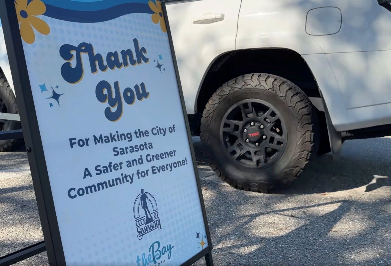Photo of an exit sign for the Shred Stock event that reads 